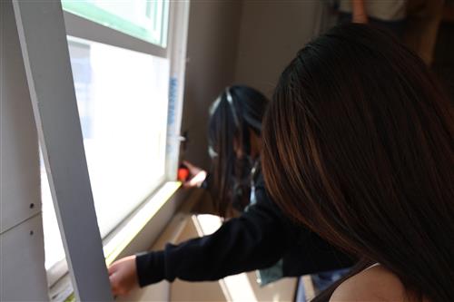 Student's working on window framing.