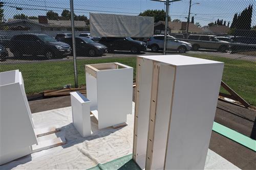 Cabinets have been painted and are drying before they are installed.