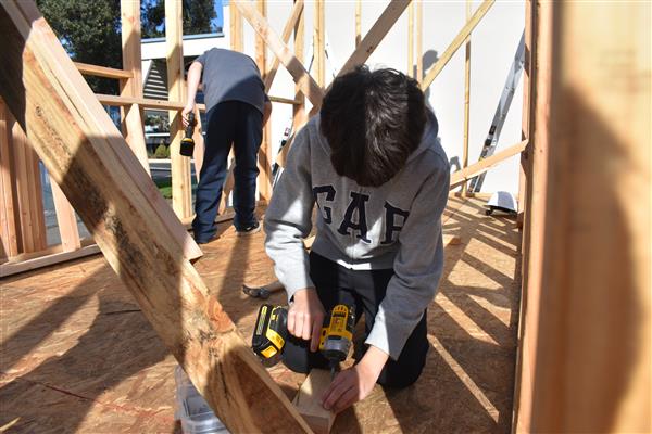 Students busy working on framing.