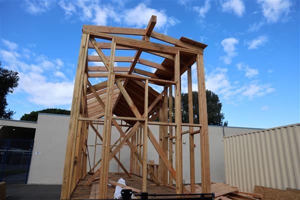 Tiny home frame and roof rafters complete, now working on putting plywood up for the roof.