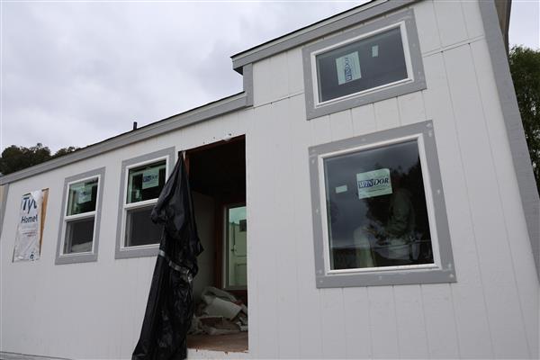 Windows have been installed and they are working on framing them.